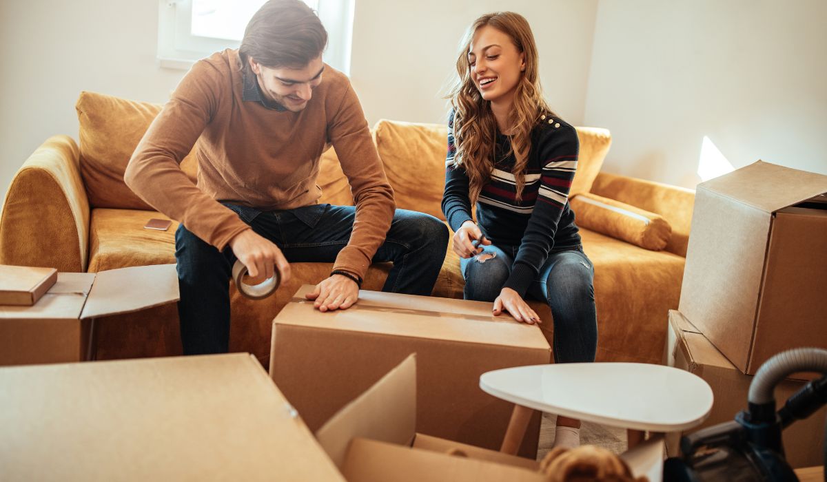 Couple Packing Boxes Bellhop