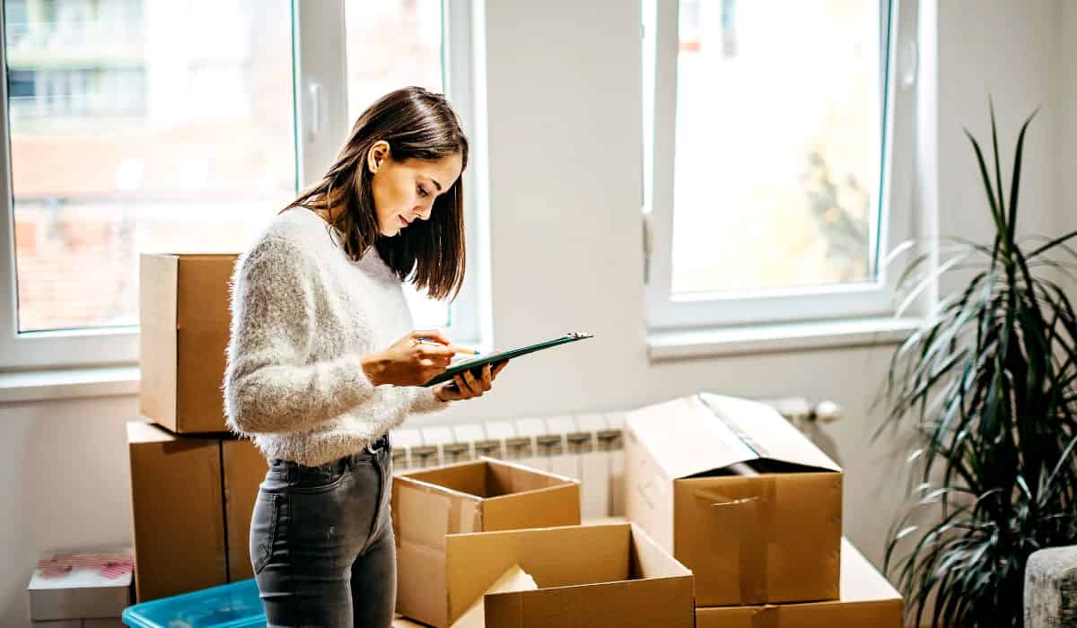 Person packing up with checklist